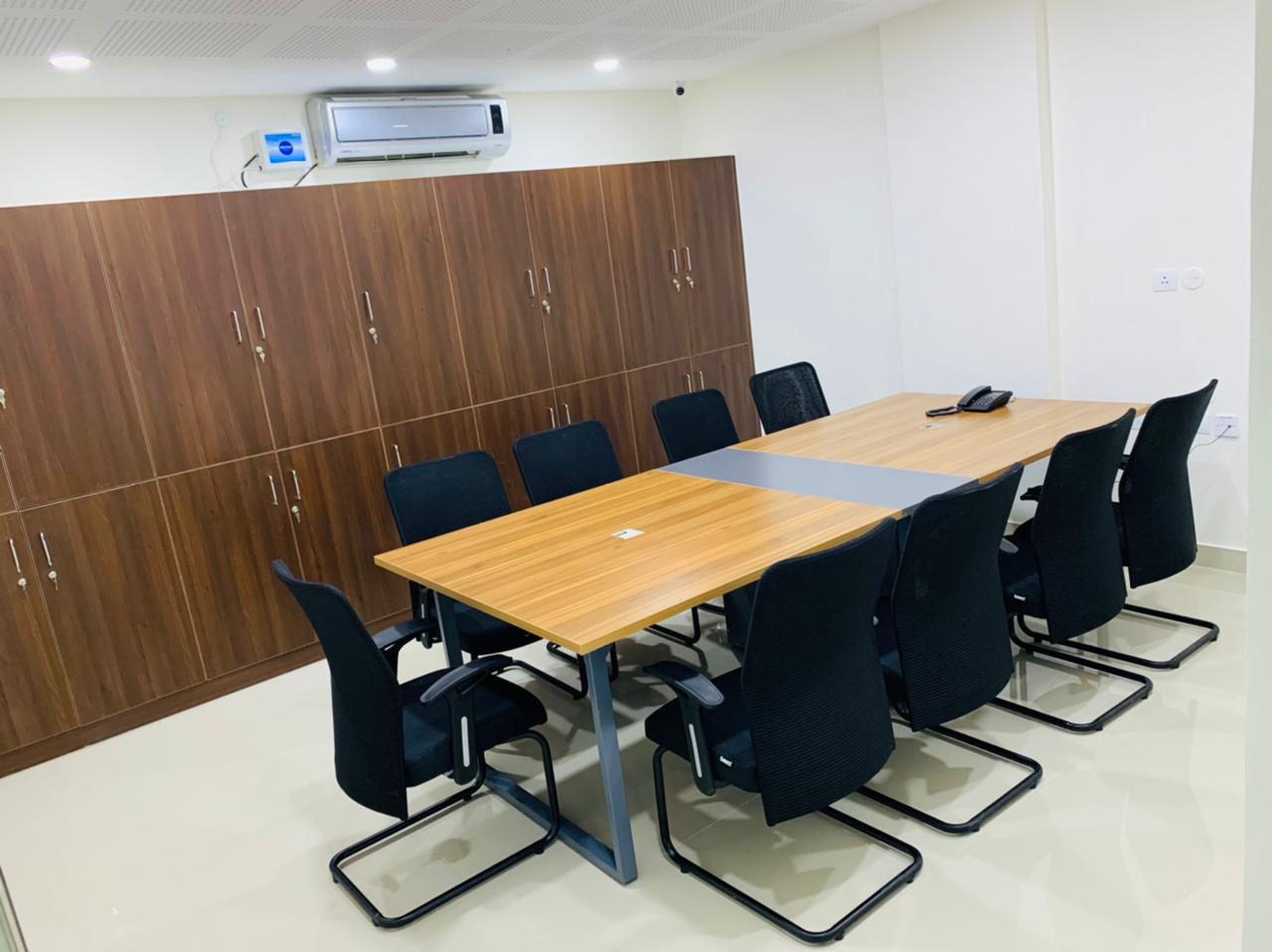 Conference table with black chairs