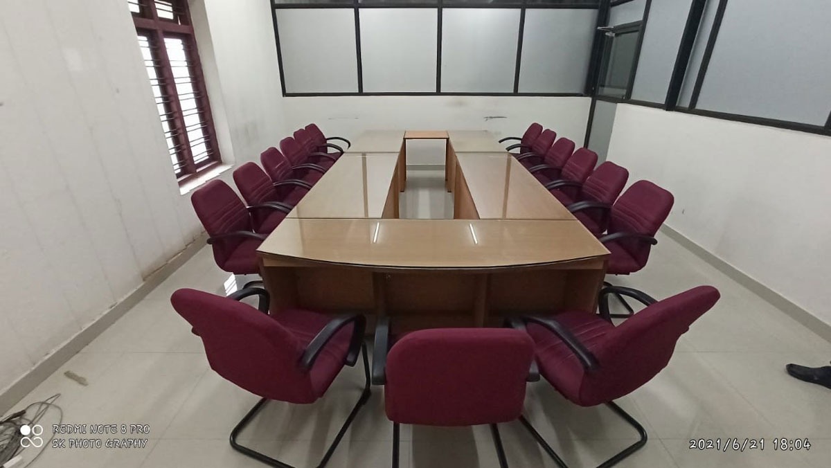 Conference table with red chairs